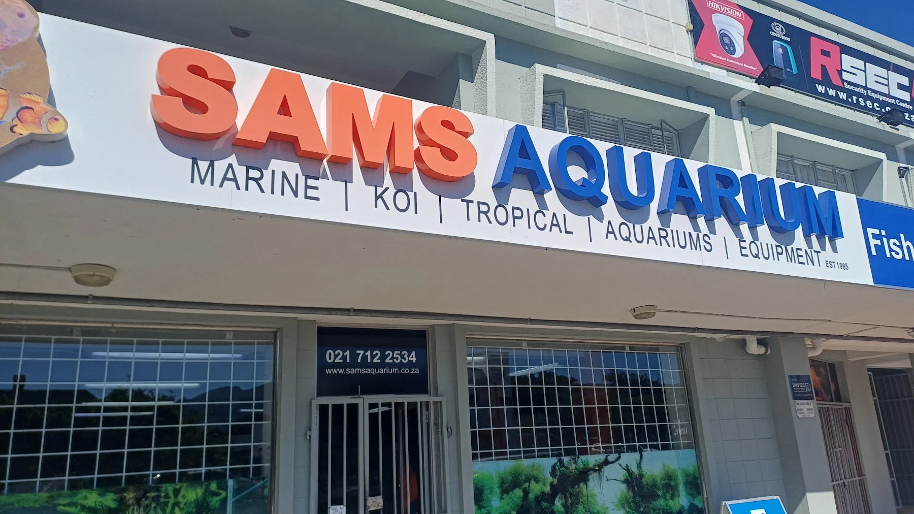 The Sam's Aquarium sign on Main Road: Marine, Koi, Tropical, Aquariums, Equipment, established 1985